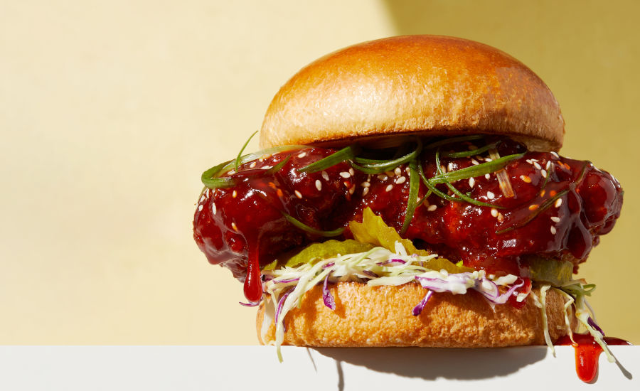 Fried chicken sandwich with hone gochujang sauce and slaw